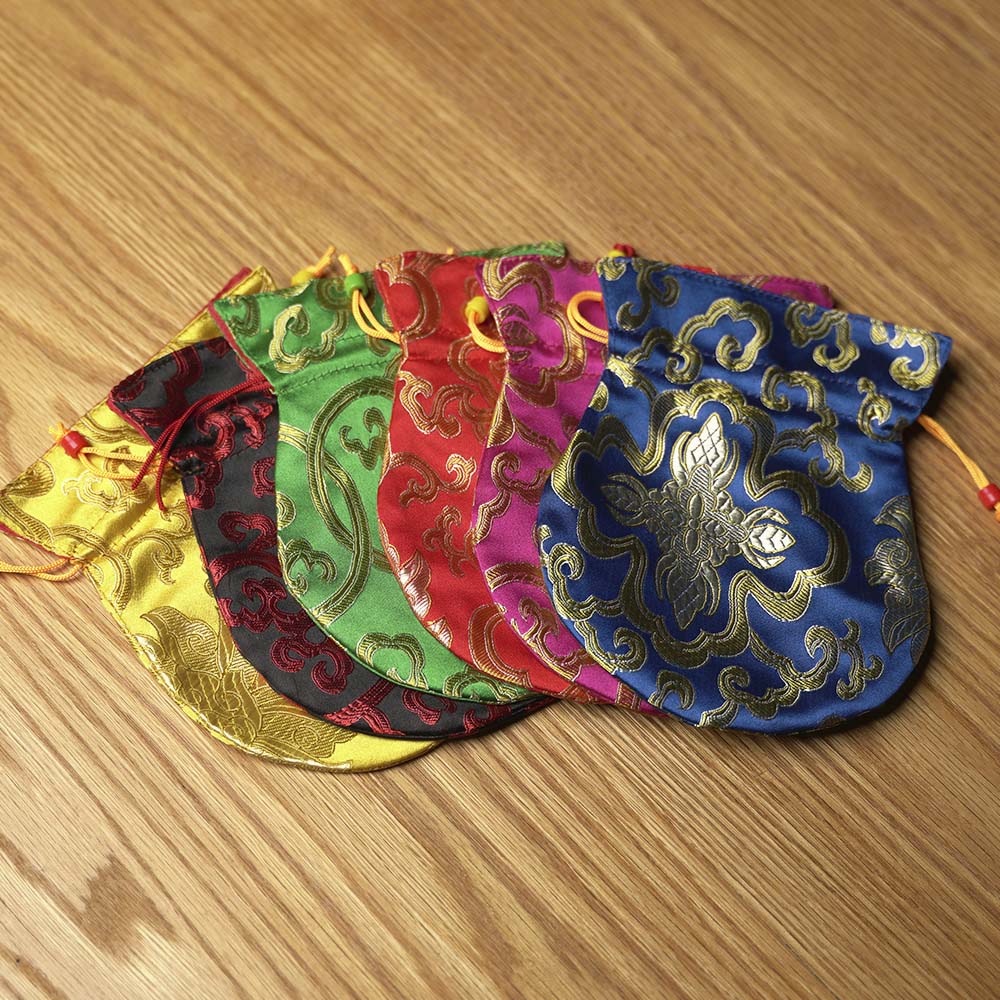 TINGSHA TIBETANA SÍMBOLOS SAGRADOS MEDIANA (7,5 CM)