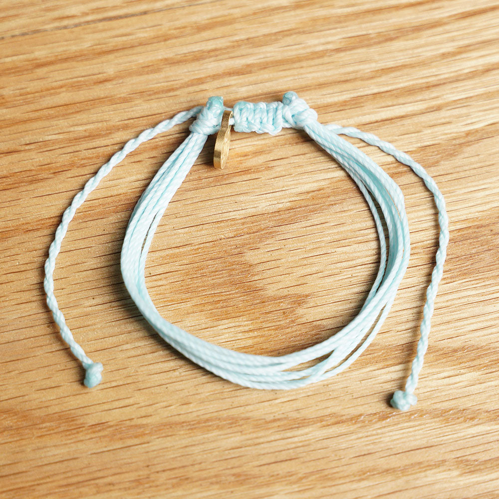 PULSERA AJUSTABLE HILO ENCERADO “COSMICA ORIGINAL CELESTE”