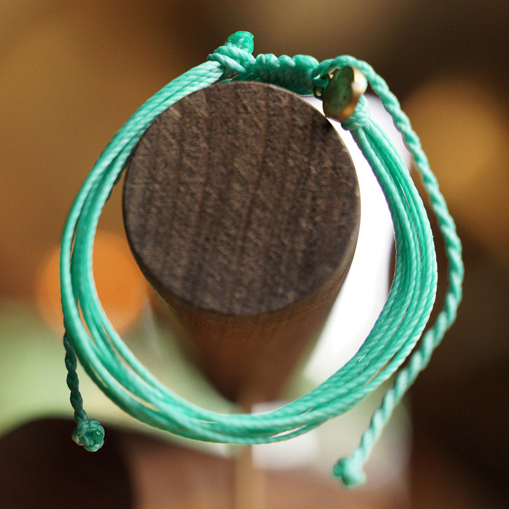 PULSERA AJUSTABLE HILO ENCERADO “COSMICA ORIGINAL TURQUESA”