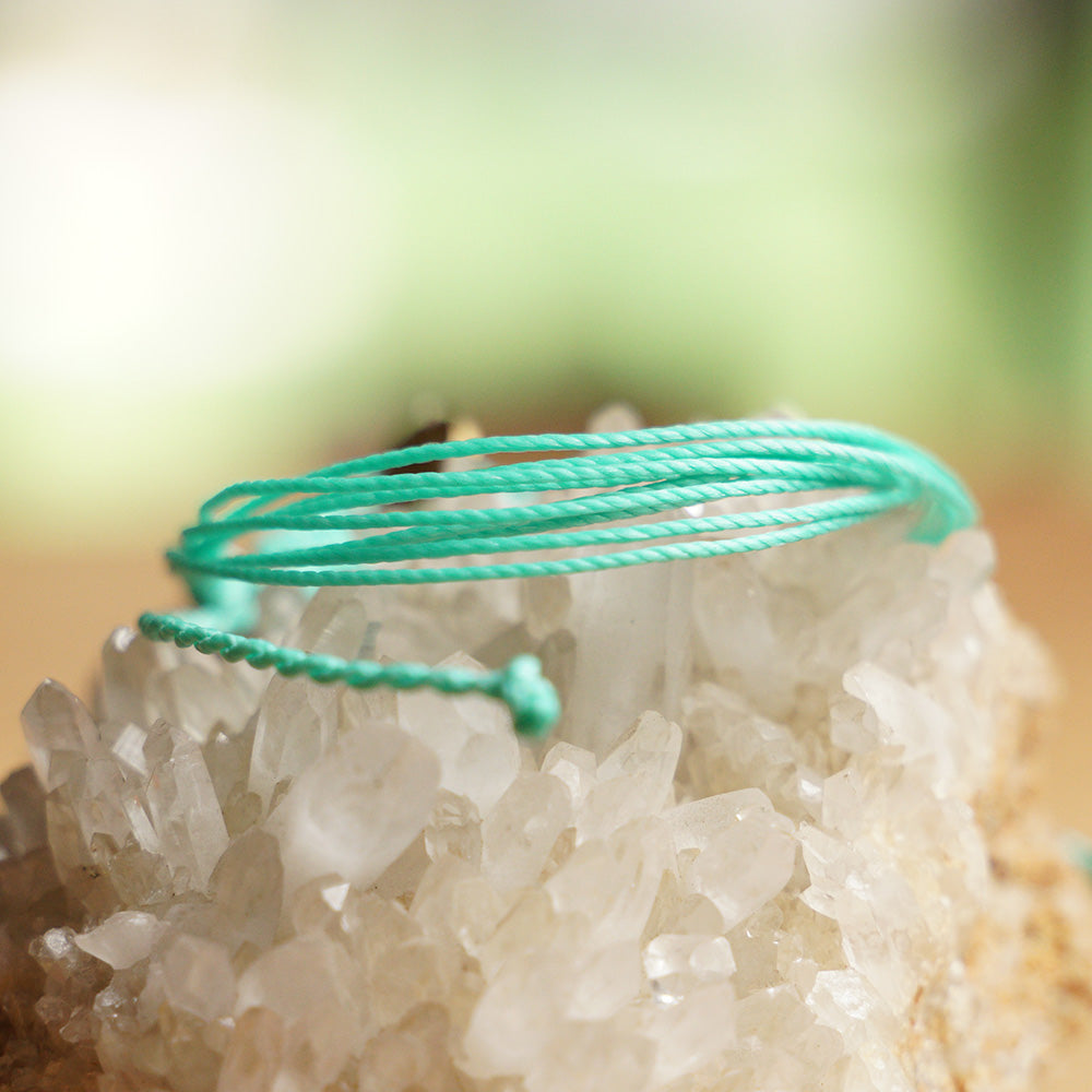 PULSERA AJUSTABLE HILO ENCERADO “COSMICA ORIGINAL TURQUESA”