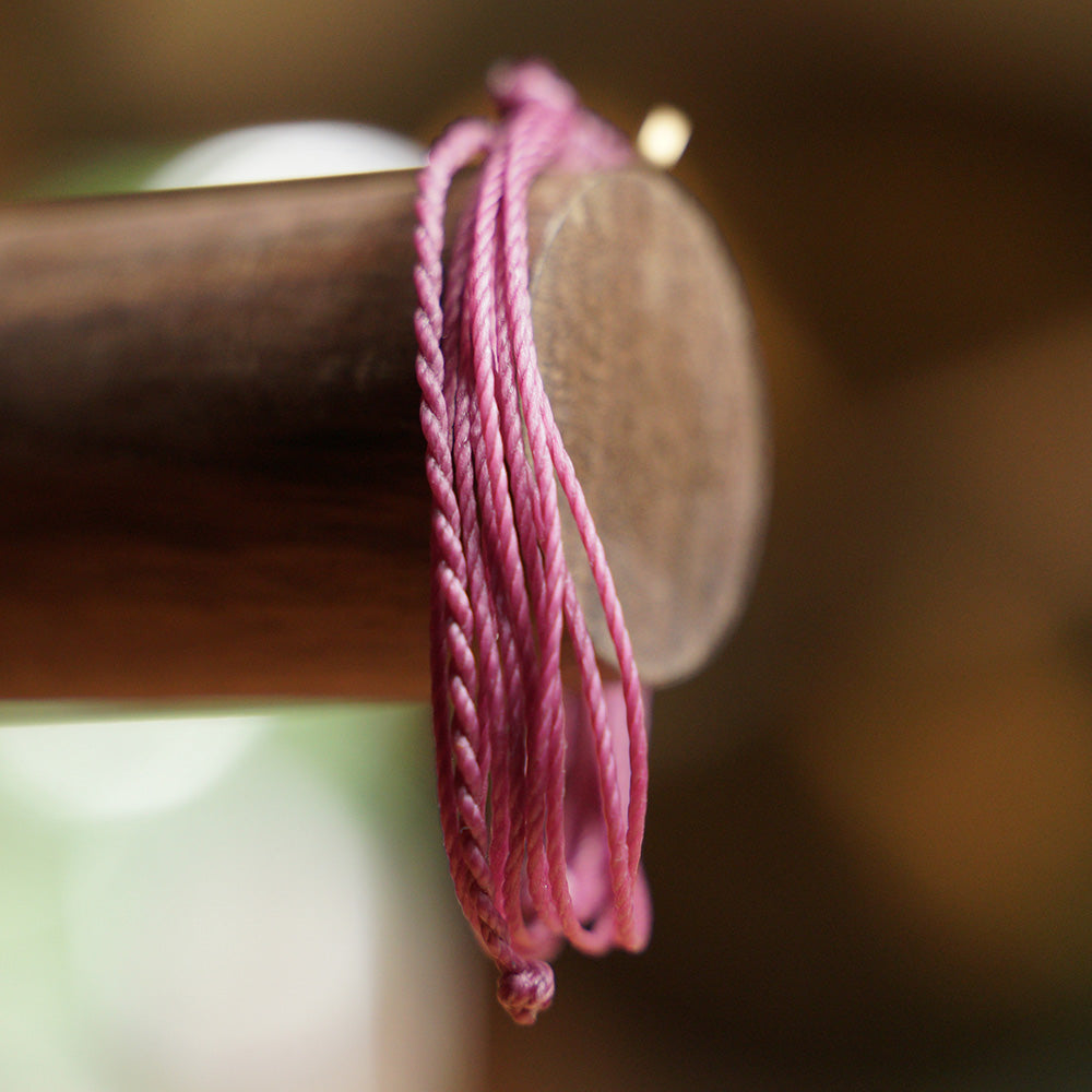 PULSERA AJUSTABLE HILO ENCERADO “COSMICA ORIGINAL MORADO”