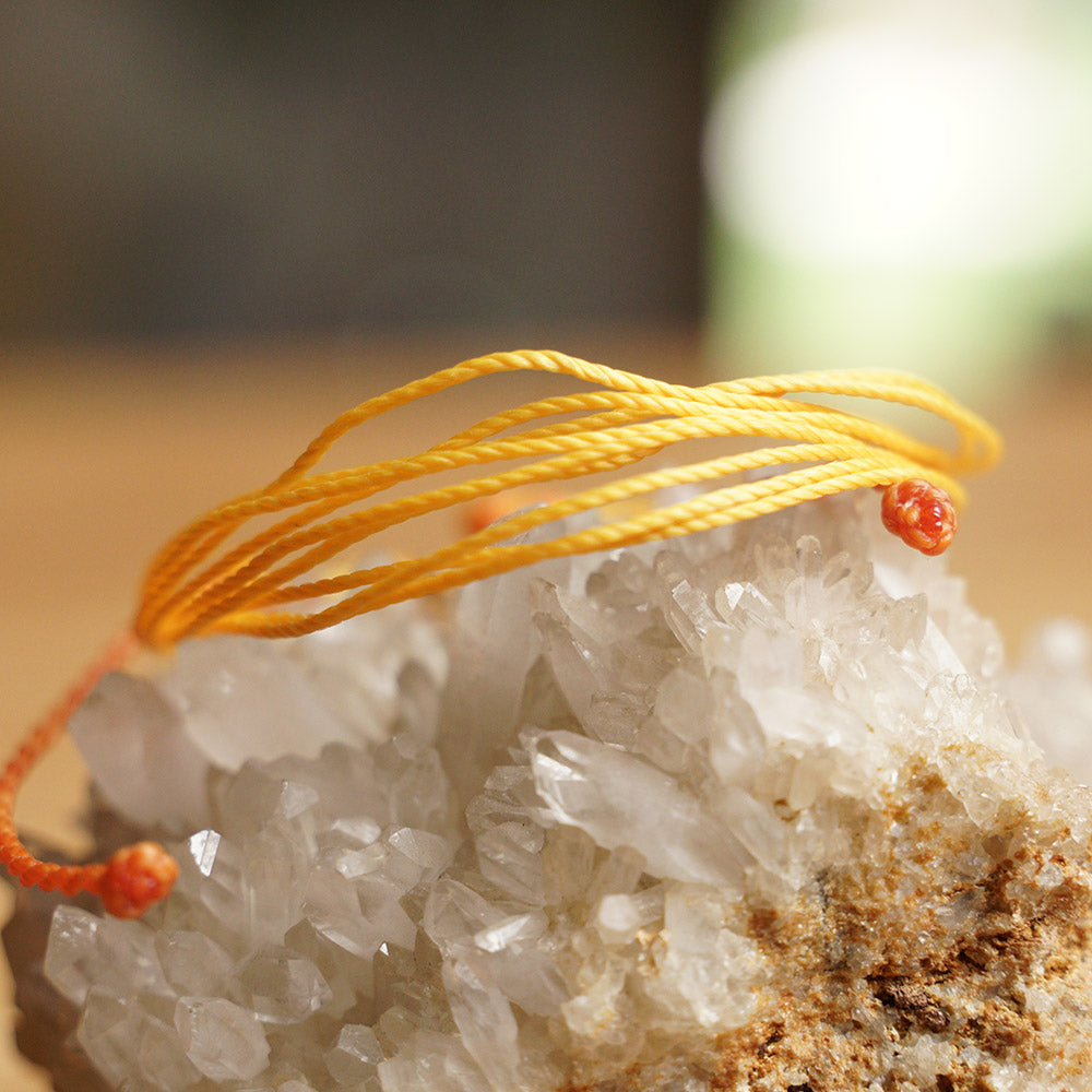 PULSERA AJUSTABLE HILO ENCERADO “GALAXIA GIRASOL”